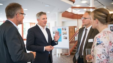 Frau Nadine Haßlöwer, Herr Michael Uhlich, Herr Henning Schulz und Herr Andreas Kersting im Gespräch.