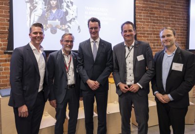 Ministerpräsident hält Rede zu Künstlicher Intelligenz vor Branchenspezialisten bei AI-Symposium