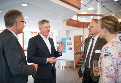 Frau Nadine Haßlöwer, Herr Michael Uhlich, Herr Henning Schulz und Herr Andreas Kersting im Gespräch.