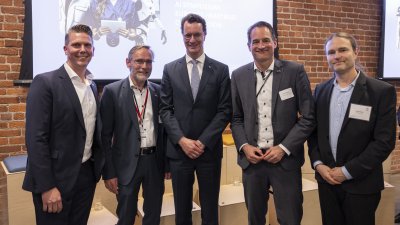 Ministerpräsident hält Rede zu Künstlicher Intelligenz vor Branchenspezialisten bei AI-Symposium