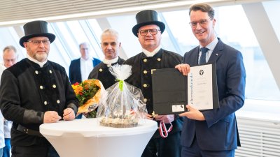 Neujahrswünsche der Schornsteinfeger und Bäcker